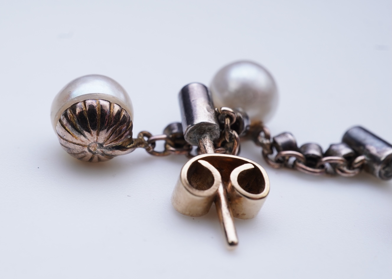 A pair of cultured pearl and diamond earrings, early 20th century and later